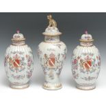 A pair of French Samson 'Chinese' lobed ovoid armorial vases and covers, decorated in the famille