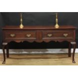 An 18th century Revival oak low dresser, rounded rectangular top above a pair of drawers, brass