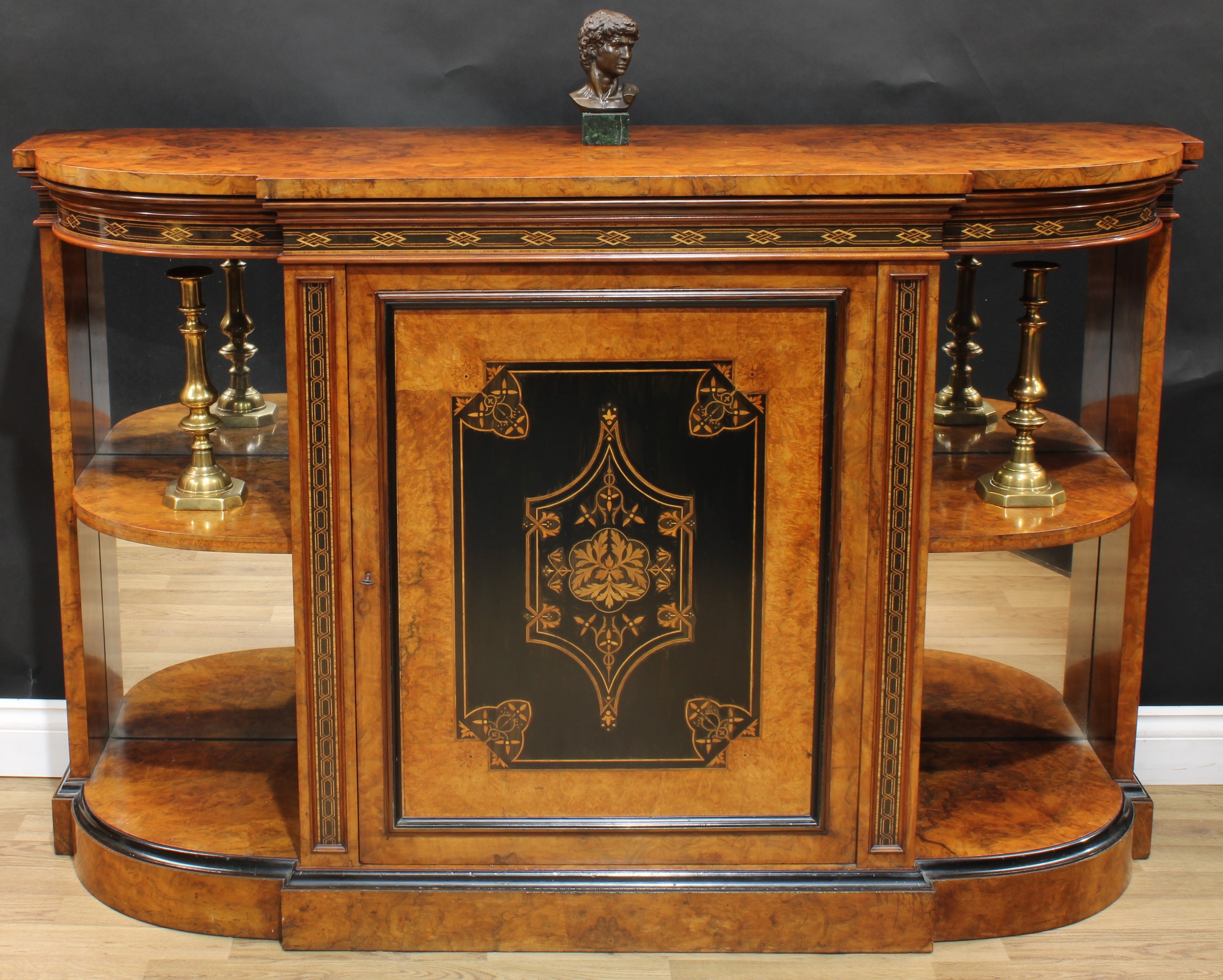 A Victorian walnut, ebonised and marquetry break-centre credenza, slightly oversailing top above a