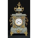 A late 19th century French gilt metal mounted marble mantel clock, 9.5cm circular enamel dial