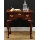 A George II mahogany lowboy, possibly Irish, oversailing rectangular top with moulded edge above