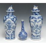 A Chinese waisted baluster vase and covers, decorated with precious objects within shaped