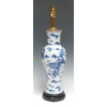 A Chinese blue and white baluster vase, decorated in underglaze blue with Dogs of Fo and clouds,