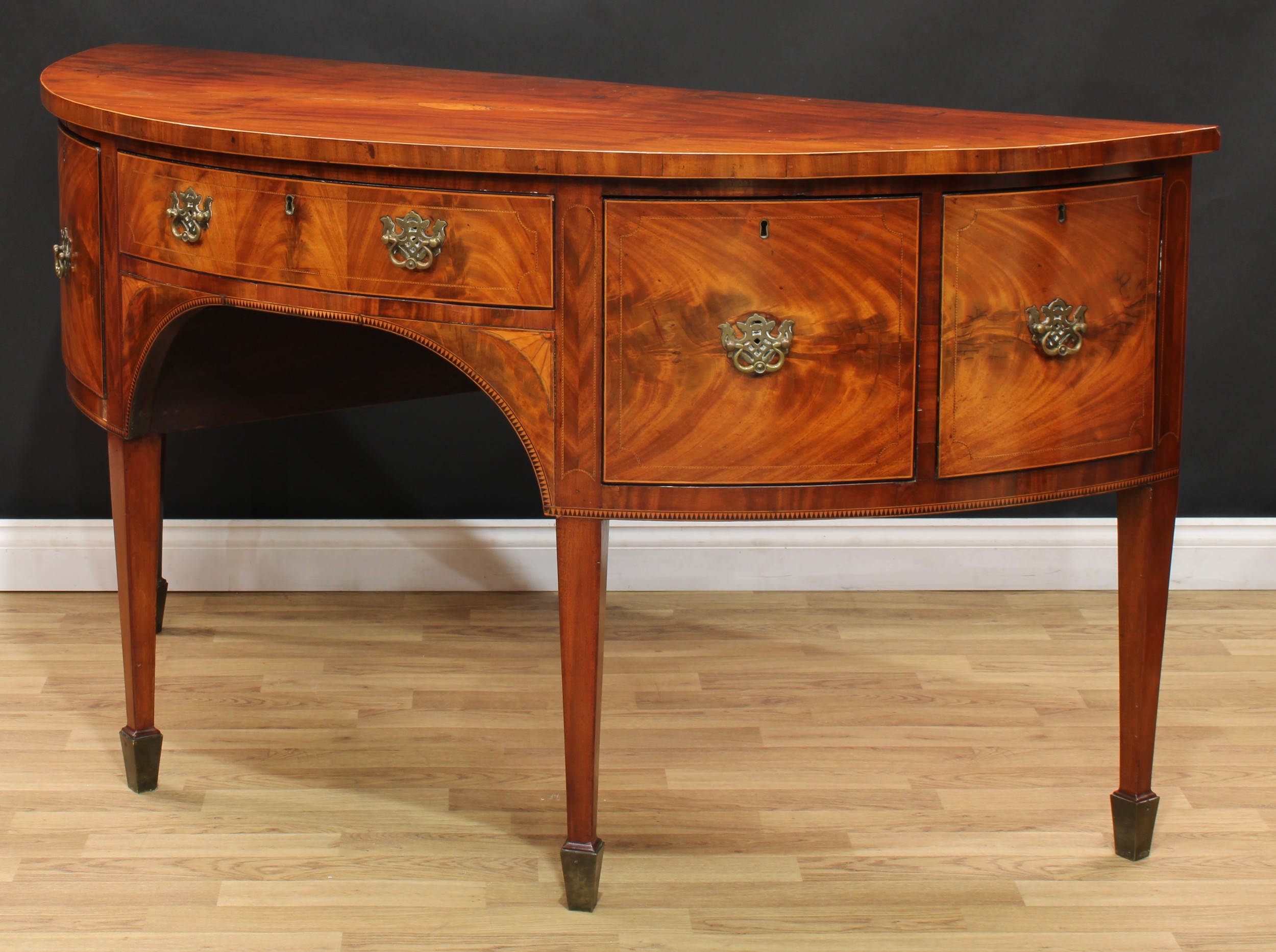 A George III mahogany demilune sideboard or serving table, slightly oversailing top centred by a - Image 5 of 6