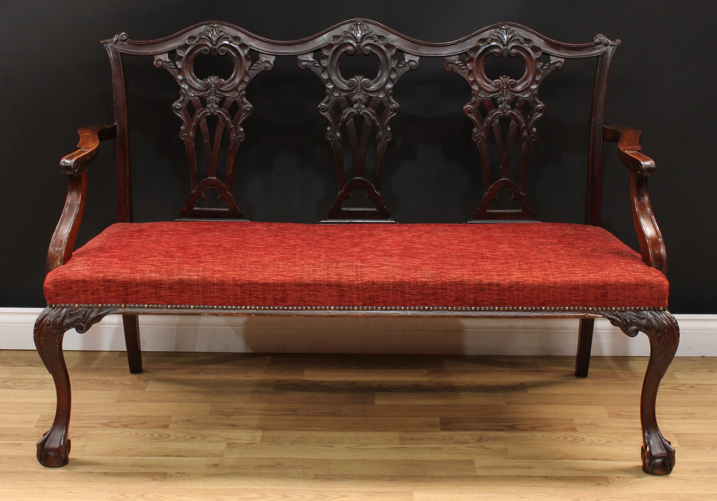 A Chippendale Revival triple chair back sofa, shaped cresting rail, shaped and pierced splats carved