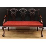 A Chippendale Revival triple chair back sofa, shaped cresting rail, shaped and pierced splats carved