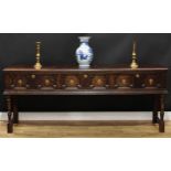 A Charles II style oak low dresser, rectangular top with moulded edge above three frieze drawers,