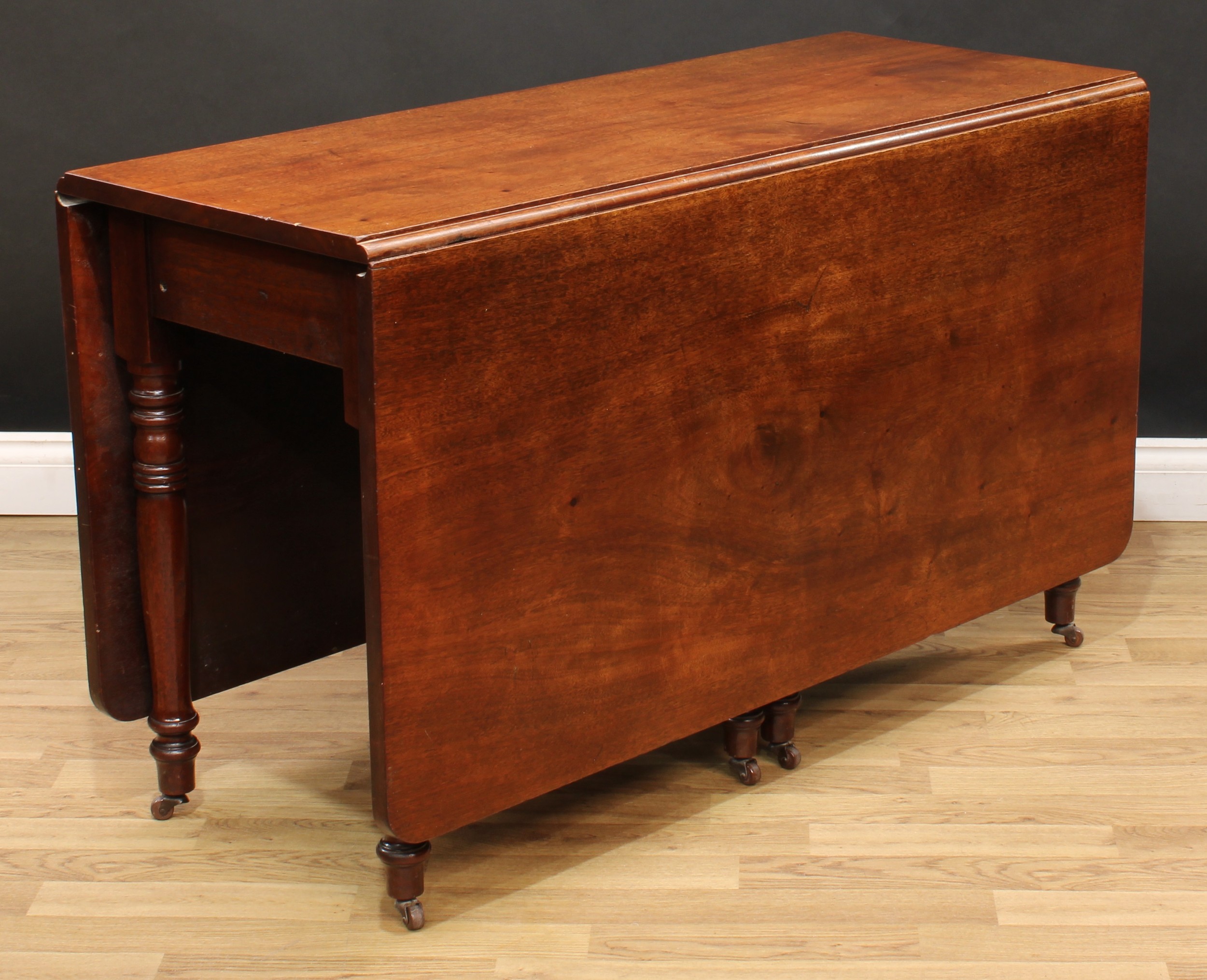 A 19th century mahogany gateleg dining table, rectangular top with fall leaves, ring-turned legs, - Image 4 of 4