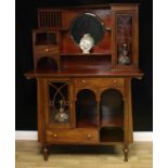 An Arts & Crafts mahogany side cabinet, asymmetrical superstructure with central bevelled mirror,