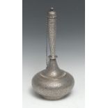 An Indian silver compressed bottle shaped flask, profusely chased overall with dense scrolling