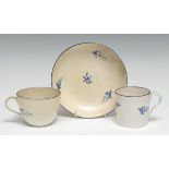 A Pinxton Bute shaped teacup, coffee cup and saucer, pattern 2, blue line border, c.1800