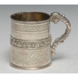 A George IV silver cylindrical mug, chased with a girdle of fruiting vine and bright-cut engraved