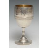 Tiffany & Co - an American silver pedestal wine goblet, engraved with a band of scrolling foliage