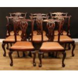 A set of eight Chippendale Revival mahogany dining chairs, comprising a pair of carvers and six side