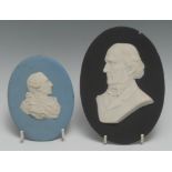 A Wedgwood blue jasperware plaque, of Louis XVI ; another, black ground, Gladstone, both with