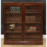 A Regency mahogany and brass marquetry bookcase, rectangular top with moulded edge above a pair of