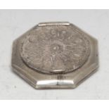 An Iraqi silver and niello octagonal compact, hinged filigree cover, decorated to verso with a