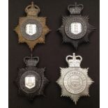 A collection of four Herefordshire Constabulary Helmet Plates: Kings Crown Night Plate: Queens Crown