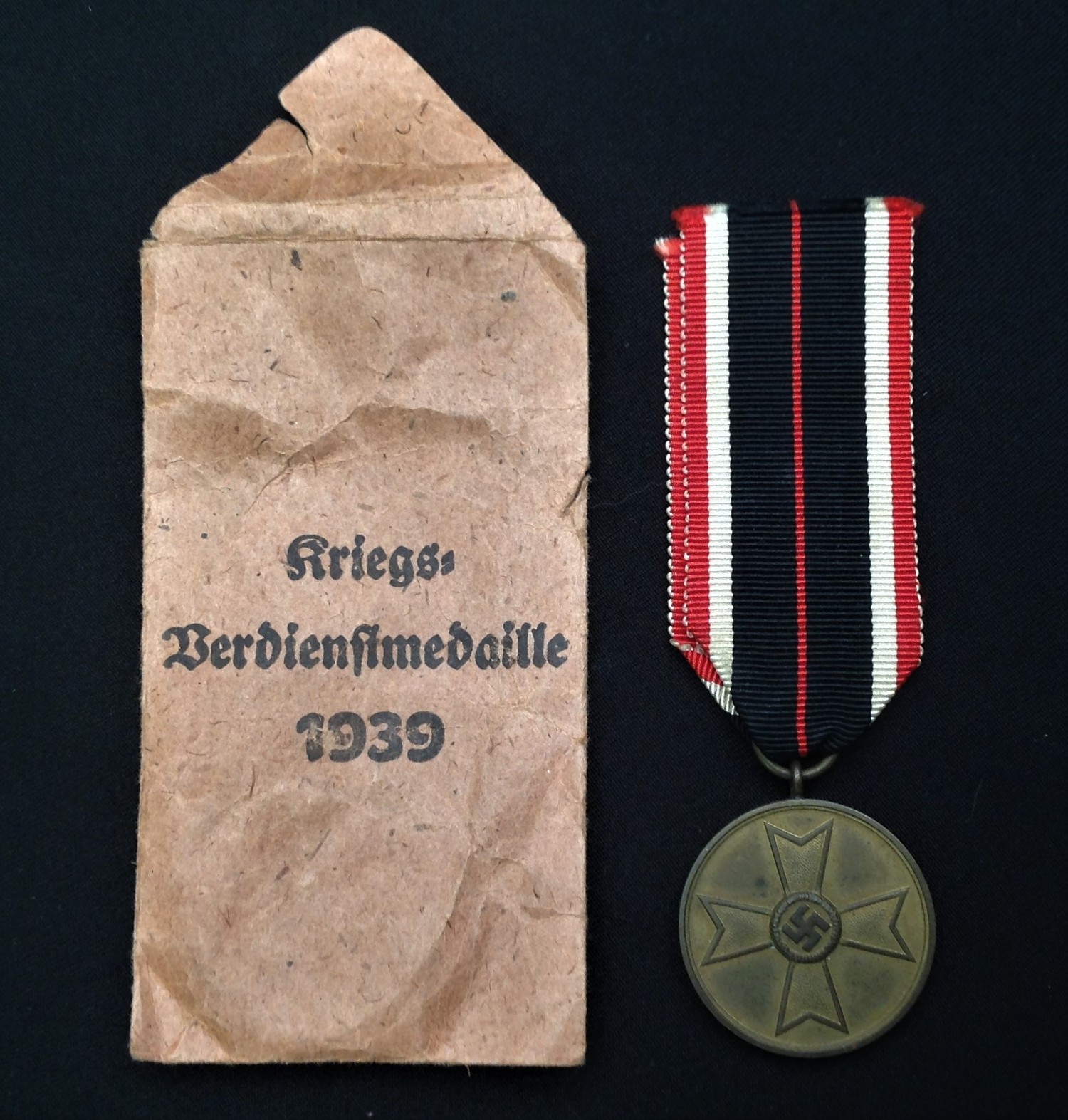 WW2 Third Reich Kriegsverdienstmedaille - War Merit Medal. Complete in original packet of issue with