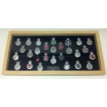 A collection of framed British Police cap badges entitled "British Police 1952" along with Motto "