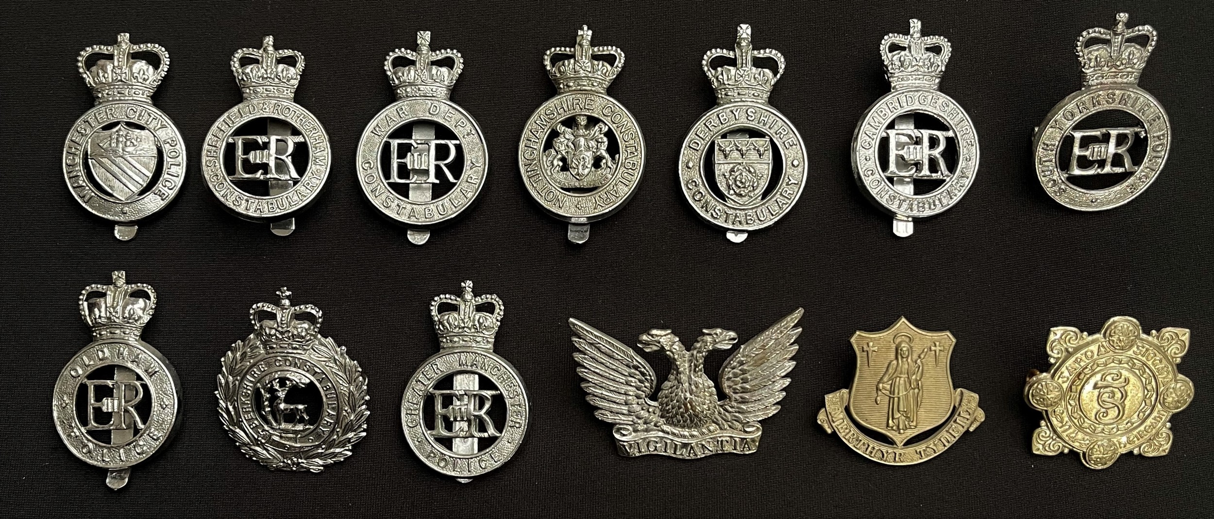 A collection of British Police Queens Crown Cap Badges to include: War Dept Constabulary: Oldham