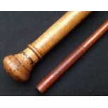 Pair of Pace sticks: one is solid turned wood construction with a steel ferule end, no marking,