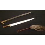 Pair of Indo-Persian Short Swords and a Horse hair fly swatter. First Sword has a ear style grip
