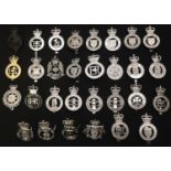 A collection of British Queens Crown Police cap badges to include: City of London, Sussex
