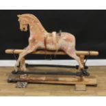 A late 19th/early 20th century English rocking horse on safety stand, probably by F H Ayres, the