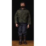 A 1970's Palitoy Action Man, brown flock hair and beard, painted blue eyes, hard plastic hands,