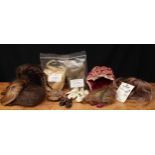 A collection of doll replacement wigs and doll shoes, comprising various replacement wigs