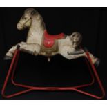 A 1960's Mobo Toys (David Sebel & Co) Prairie King spring rocking horse on stand, painted pressed