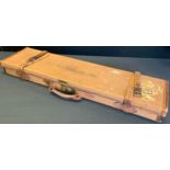 Shooting - an early 20th century brown canvas rectangular gun case, hinged cover, brass fittings,