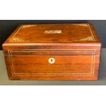 A Victorian rosewood dressing table box, the cover with mother-of-pearl stylised foliage, 28cm wide,