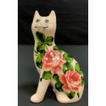 A Wemyss G Hill Pottery model seated cat, 17.5cm high; a standard lamp; pair of Chinese style floral