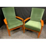 A pair of Parker Knoll mid 20th century arm chairs, upholstered in green, These items may not comply