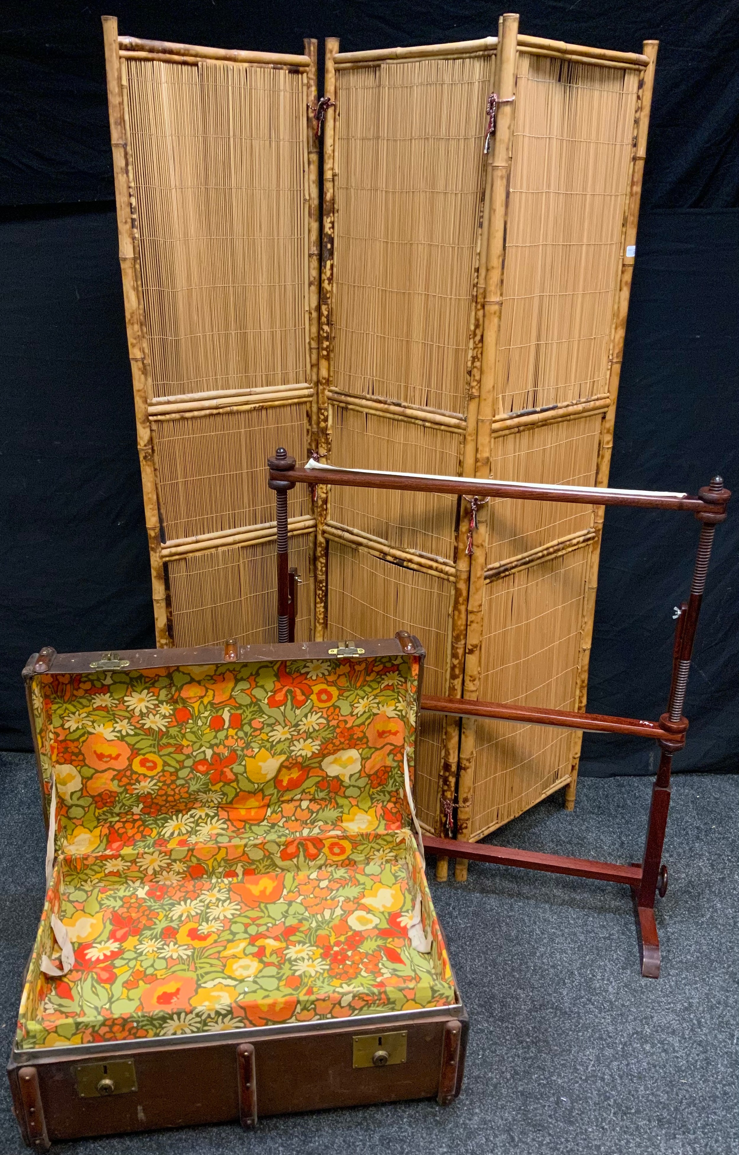 A three fold bamboo modesty screen; a tapestry frame; an early 20th century trunk (3)