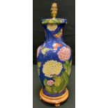 A contemporary Chinese baluster form lamp decorated with large chrysanthemum flower heads and