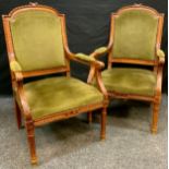 A pair of Edwardian mahogany open arm chairs, tapered fluted legs (2)