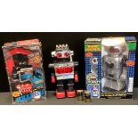 A Jupiter walking Robot, boxed; Smoking Robbie radio control robot, boxed; another robot unboxed (3)