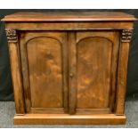 An early Victorian rosewood side cabinet, two arched fielded panelled doors, 83m high, 95cm wide.