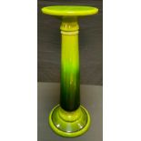 A Bretby jardiniere stand, in tones of green, 78cm high, impressed mark, 1471.