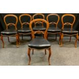 A set of six Victorian mahogany kidney back dining chairs, stuffed over brass studded leatherette