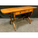 A reproduction mahogany sofa table, crossbanded top, two drawers, X frame legs, turned stretcher,