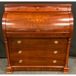 A modern cylinder desk, the roll top decorated with urn and scrolls, tootled leather surface,