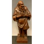 A 19th century Northern European oak carving, of a friar, 39cm high, c.1860