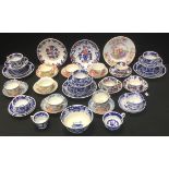 A Staffordshire blue and white tea service, printed with stylised flowers, comprising five cups