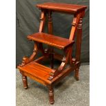 A set of mahogany reproduction library steps, reeded back supports, scrolling front supports, turned