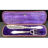 A pair of Victorian silver and mother-of-pearl hafted fish servers, pierced and engraved with