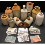 A collection of stoneware jars and hot water bottles, including a Hansons Ltd Kimberley Brewery